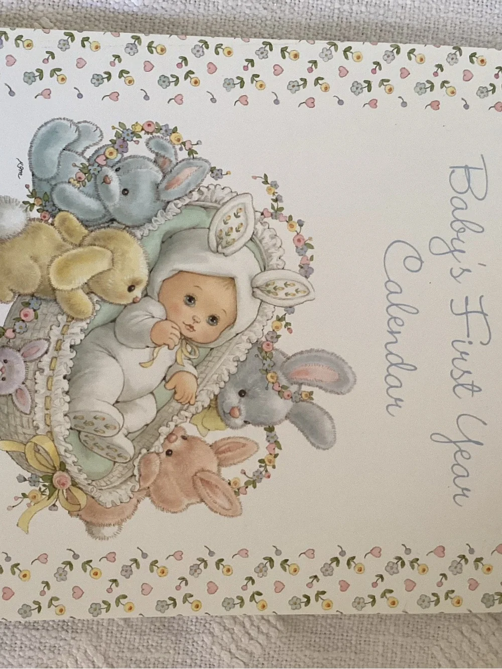 Baby’s first year calendar and milestone hardcover keepsake book